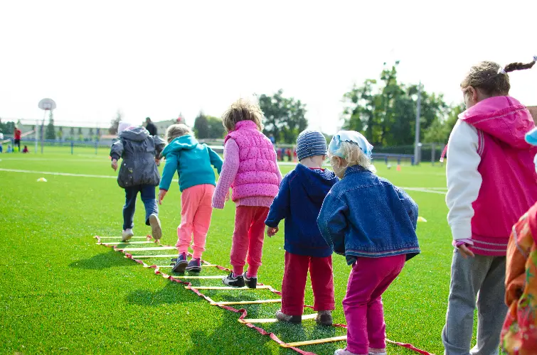 Children moving through a ladder.