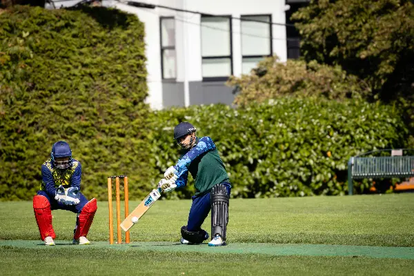 Player batting the ball in cricket.